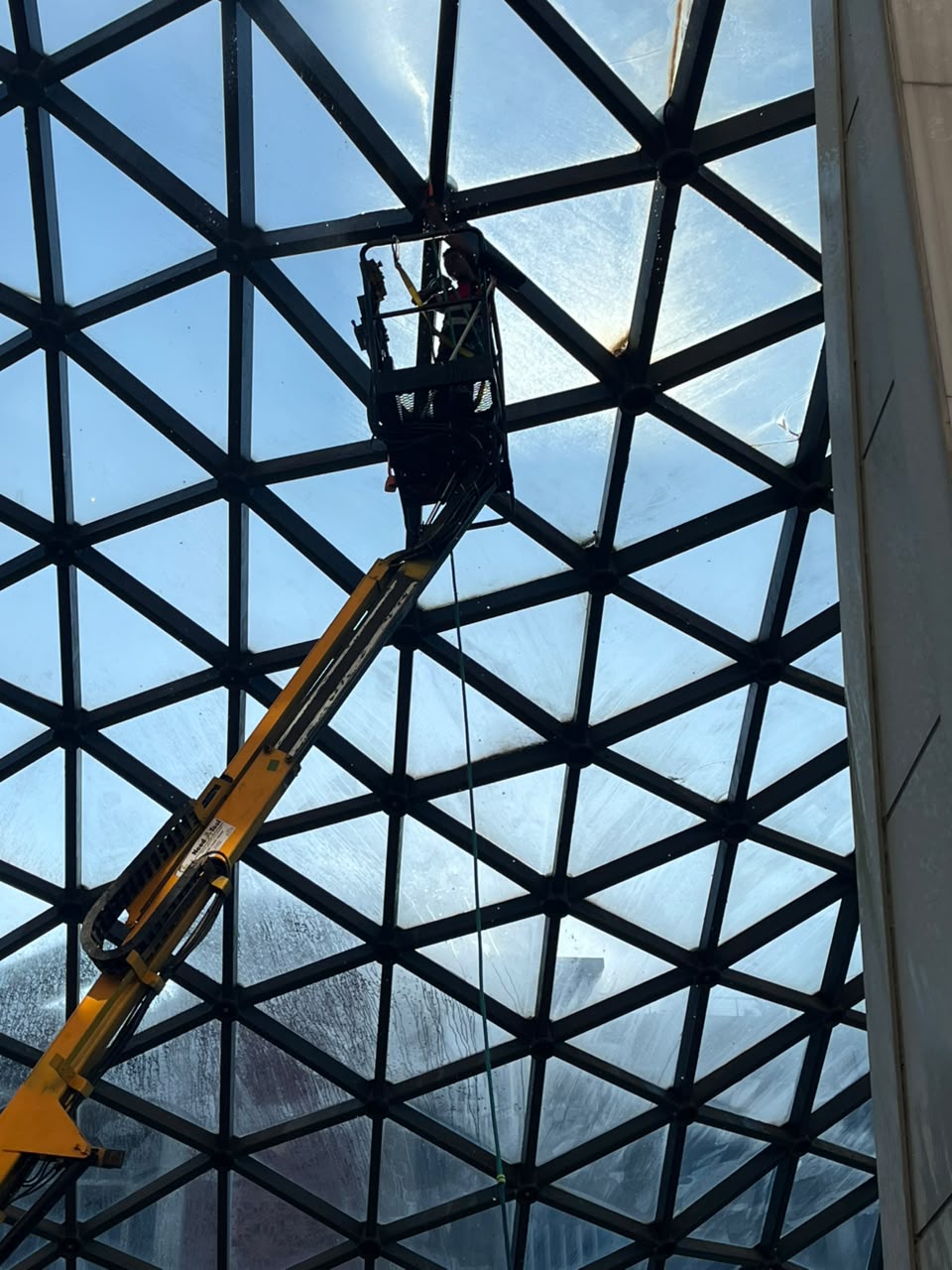 Cherry picker glass dome cleaning