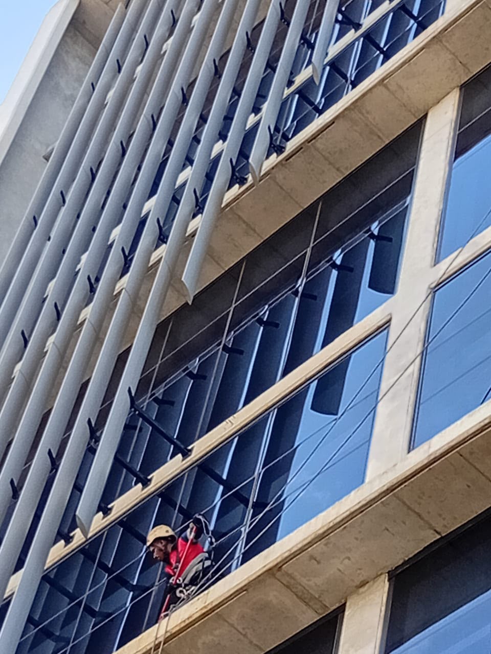 Rope access facade cleaning - high-rise louvres